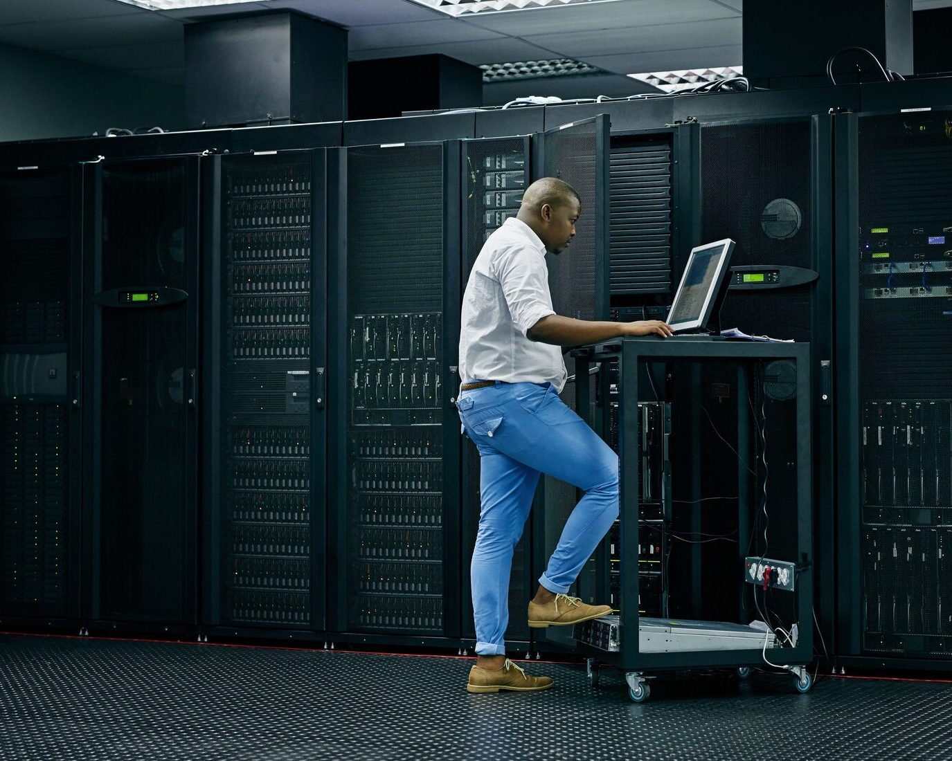https://sparktech.agency/wp-content/uploads/2025/04/skilled-in-all-things-it-shot-of-an-it-technician-using-a-computer-while-working-in-a-data-center--e1745215376687.jpg